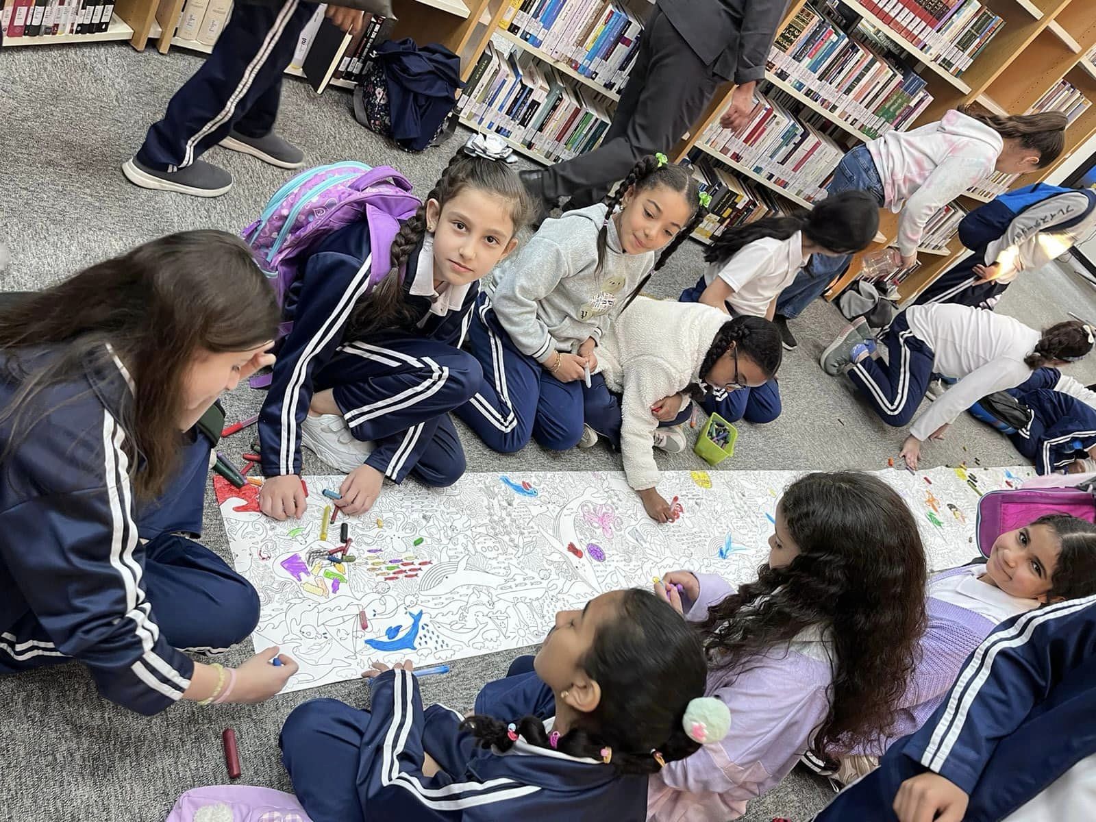 Exploring the world of knowledge at Al Wathba Library! 📚🌍